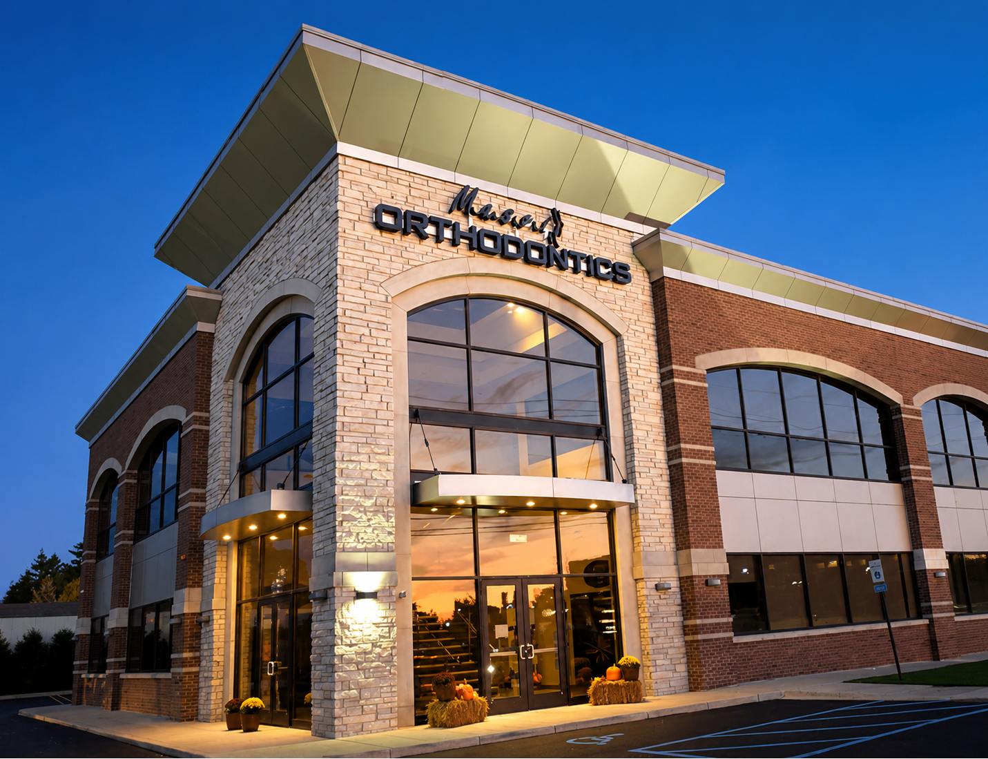 Exterior of the Masri Orthodontics building in Livonia, MI at dusk