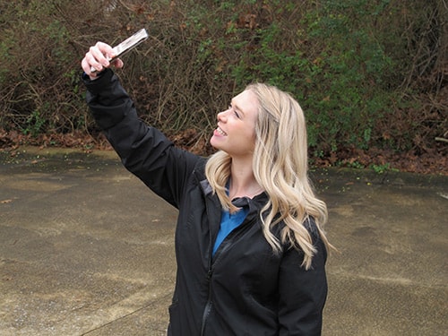 Woman taking a selfie of her smile for an online smile assessment
