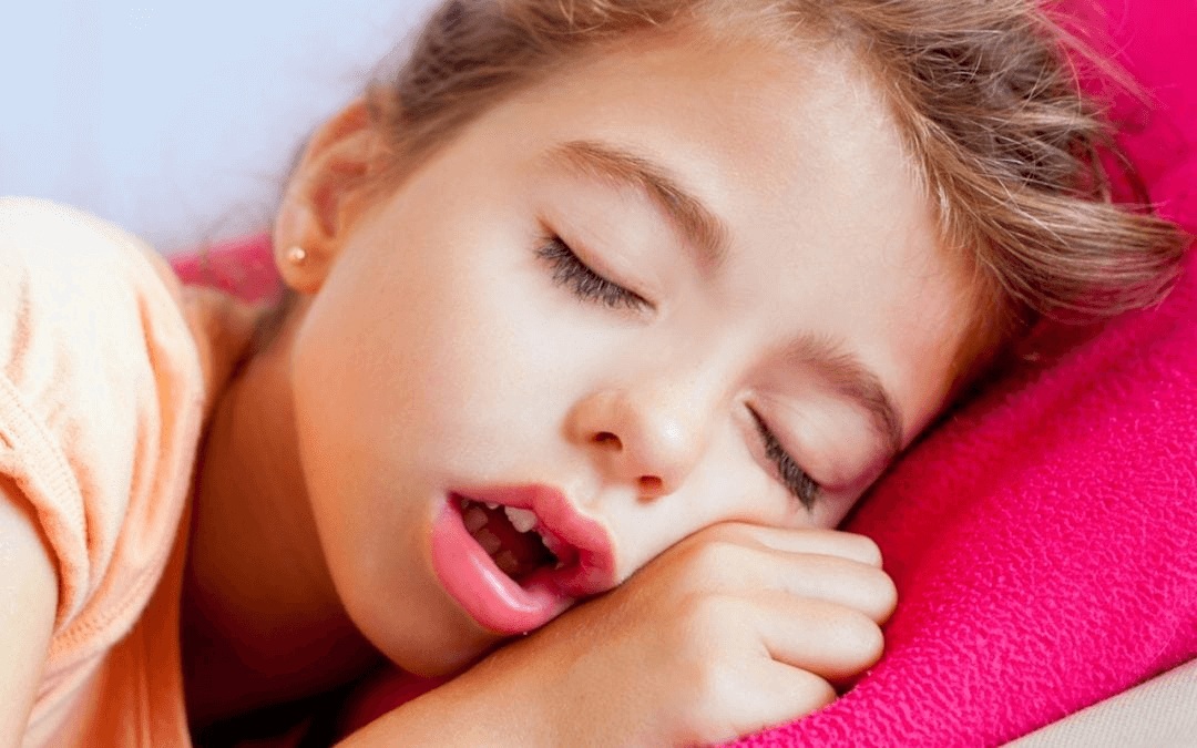 Young girl sleeping with her mouth open